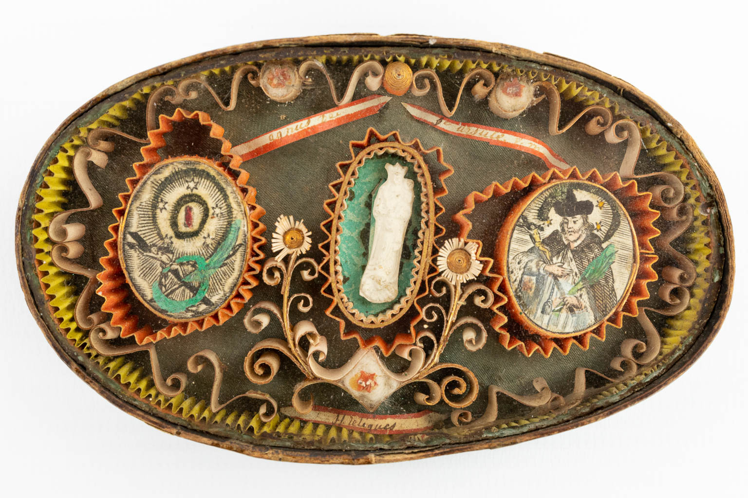 An antique relic in an oval box, marked Agnus Dei, H Reliques. - Image 6 of 11