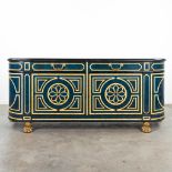 A sideboard with faux Lapis Lazuli and inlaid bone in Hollywood Regency style, standing on bronze cl