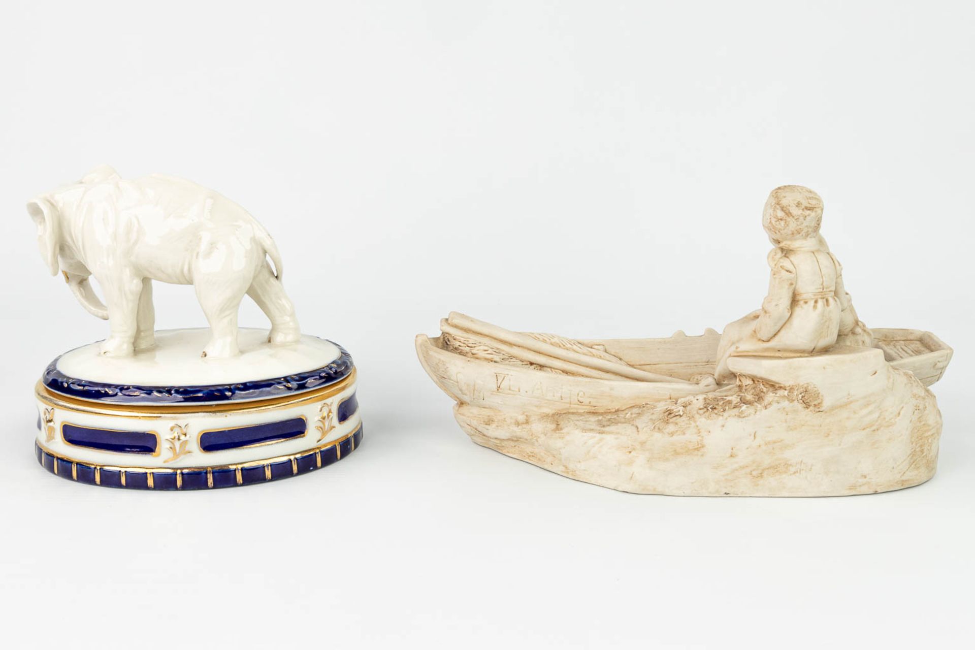 A collection of 2 pieces of Royal Dux porcelain: 'Boys in a boat - Bonbonire with an elephant'. (H: - Image 8 of 13