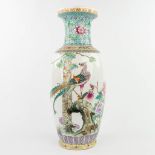 A Chinese vase made of porcelain and decorated with peacocks. (H: 60,5 cm)