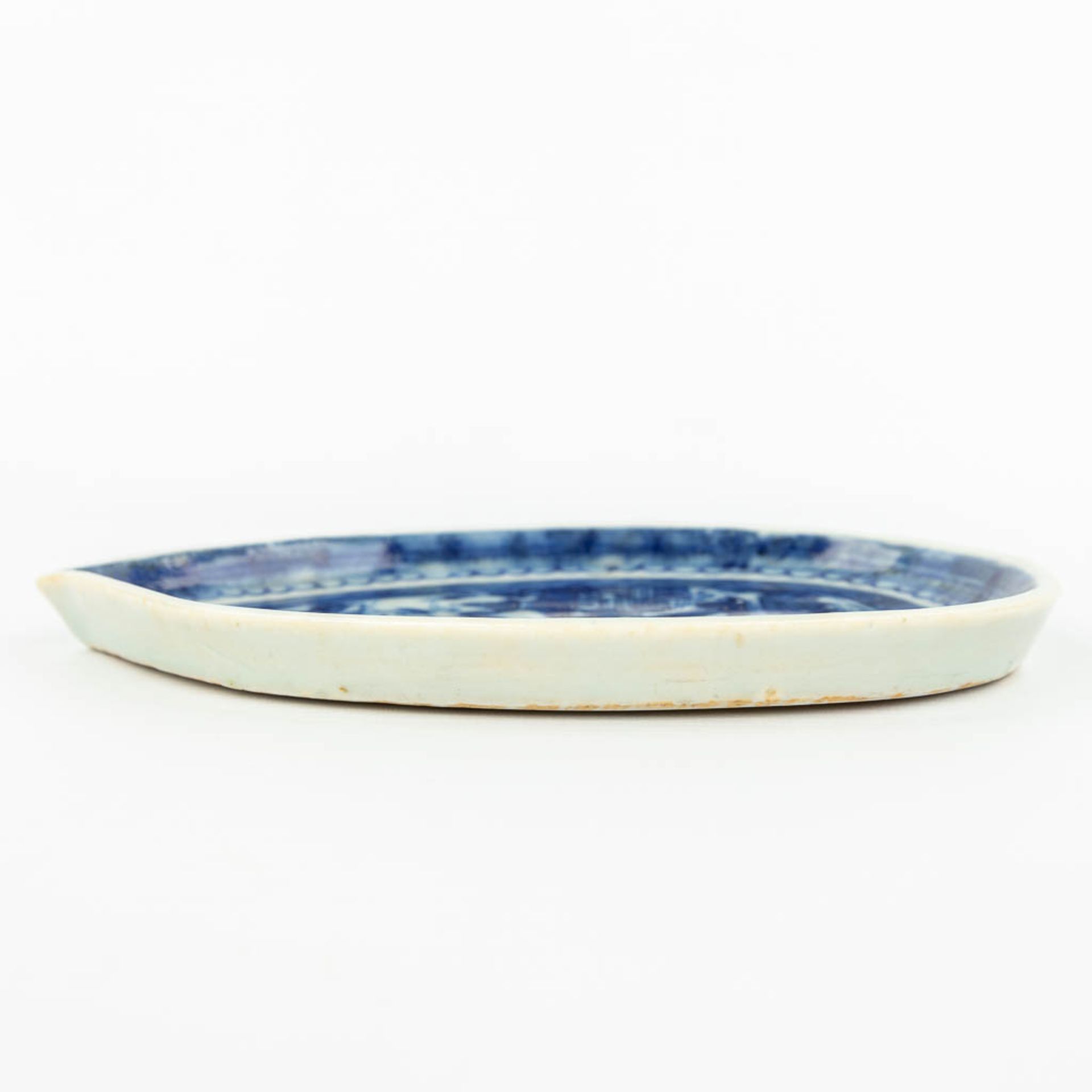 A Chinese dish made of porcelain with a blue-white landscape decor. - Image 3 of 10