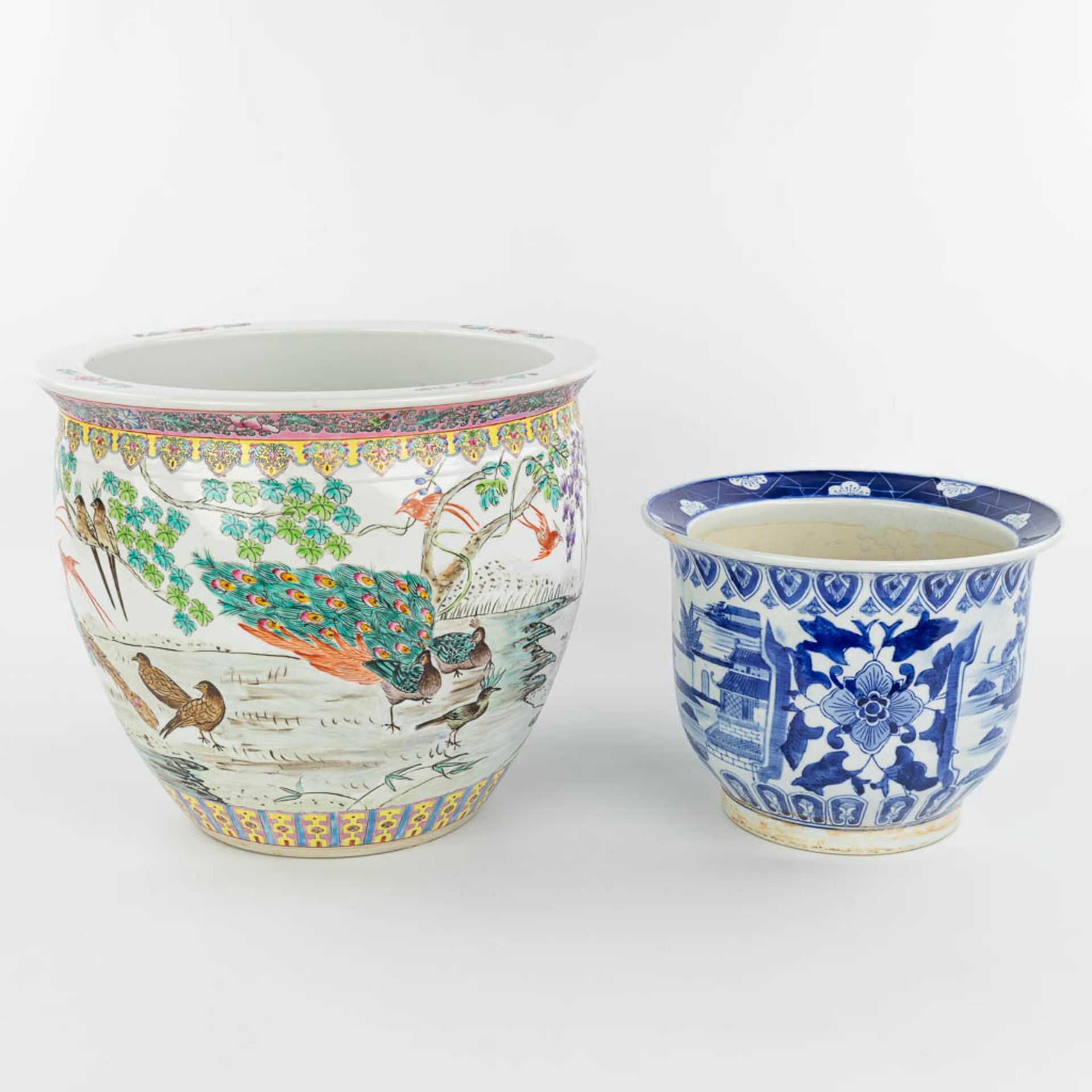 A set of 2 Chinese cache-pots made of porcelain of which 1 has a blue-white decor and the other a de - Image 4 of 15