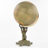A 'Globe Terrestere' marked A. Benoit & Cie, Paris. standing on a cast-iron base decorated with a pu