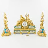 A three-piece garniture clock with candelabra, made of gilt bronze and decorated with sèvres plaques