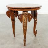 An Anglo-Indian coffee table made of hardwood and decorated with marquetry inlay and elephants. (H:4