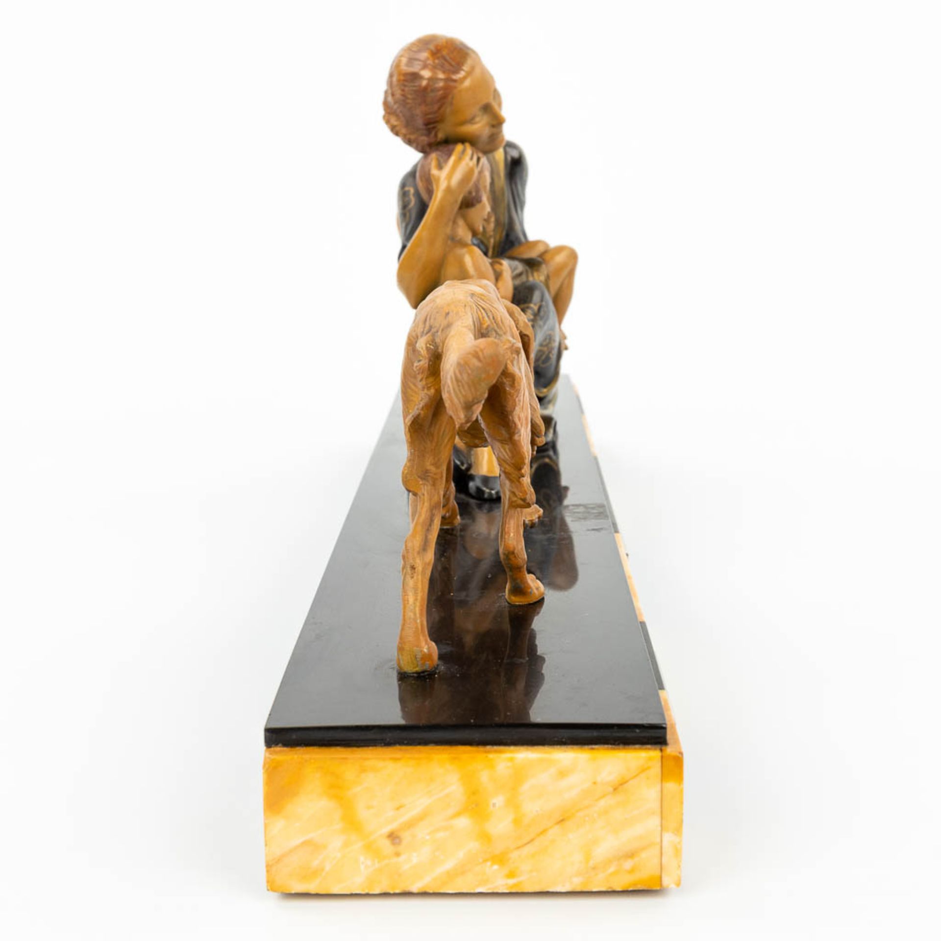 An art deco style statue of a woman with child and her dog, made of spelter and mounted on a marble - Image 2 of 12