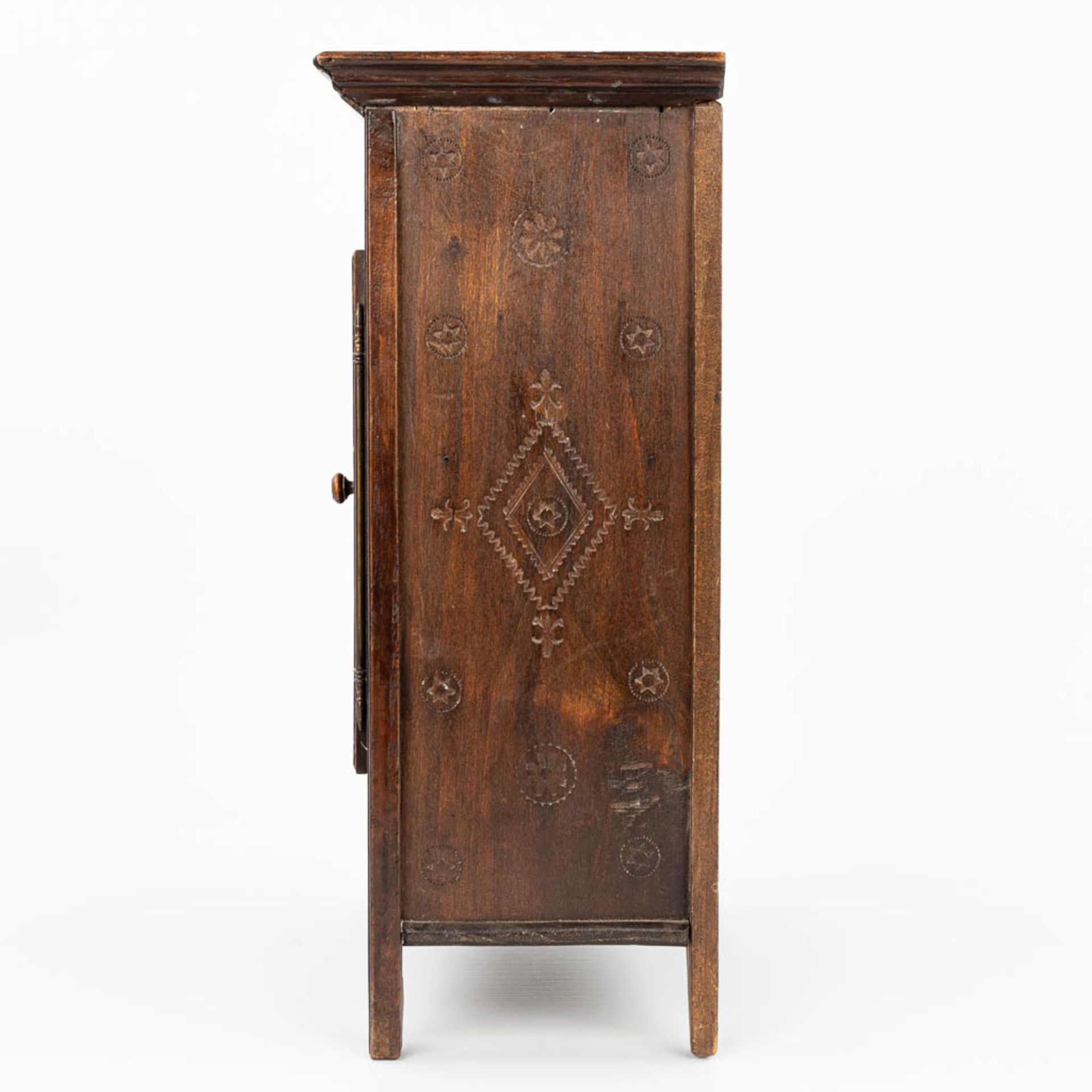 A miniature Breton cabinet, made of sculptured wood. (H:37cm) - Image 4 of 14