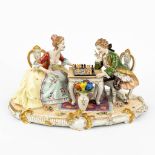 A large porcelain group of a chess-playing couple marked O. Enders and Volkstedt-Rudolstadt. (H:23cm