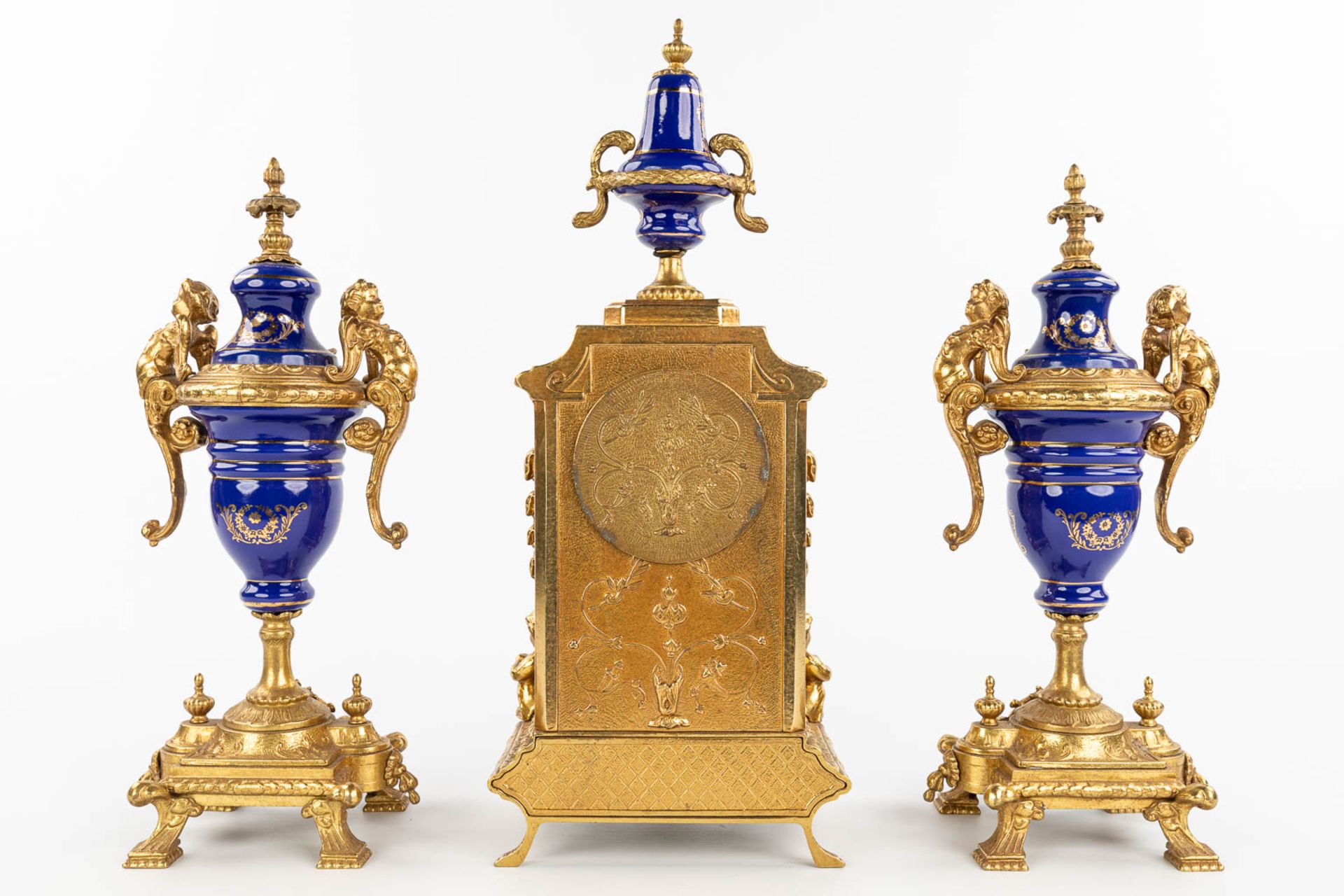 A three-piece mantle garniture clock made of bronze and porcelain and marked Imperial. (H:43cm) - Image 6 of 12