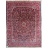 A large Oriental hand-made carpet. Kachan. (238 x 315 cm)