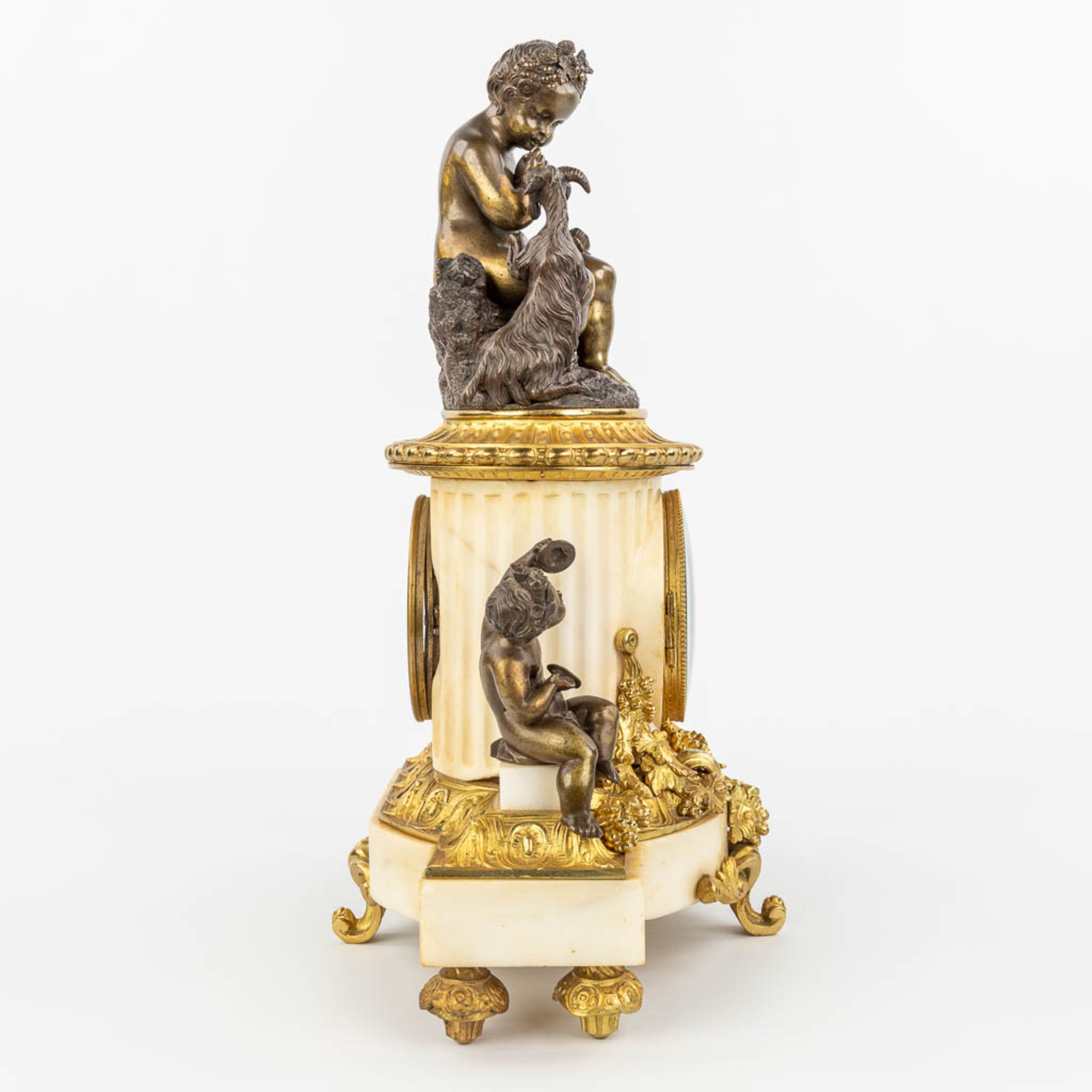 A clock made of marble and decorated with gilt and patinated bronze in Louis XVI style. (H:42cm) - Image 2 of 12