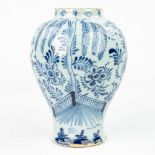 A vase made of Delft faience with blue-white decor. (H:19cm)