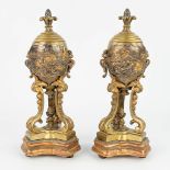 A pair of bronze cassolettes with images of knights in battleÊsigned William McLaren. (H:36cm)