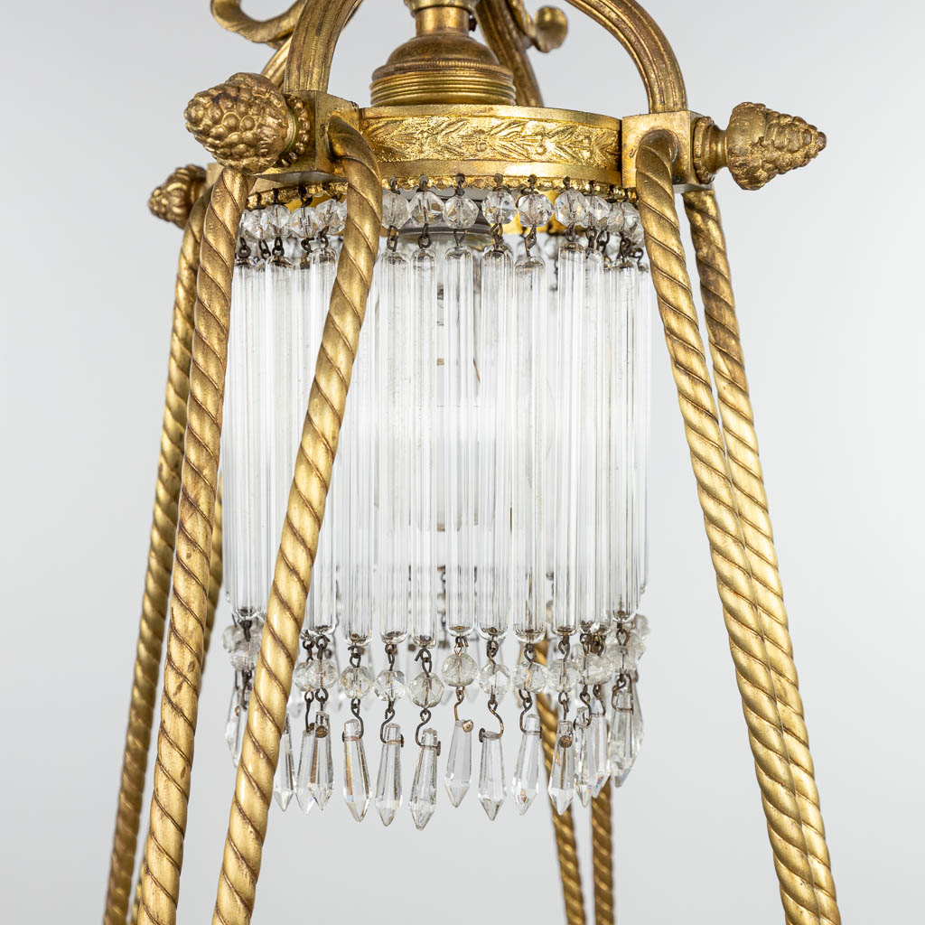 A chandelier made of bronze in Louis XVI style and finished with bisque plaques. (H:100cm) - Image 8 of 10