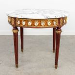 A coffee table with marble top and plaques made of porcelain. (H:49cm)