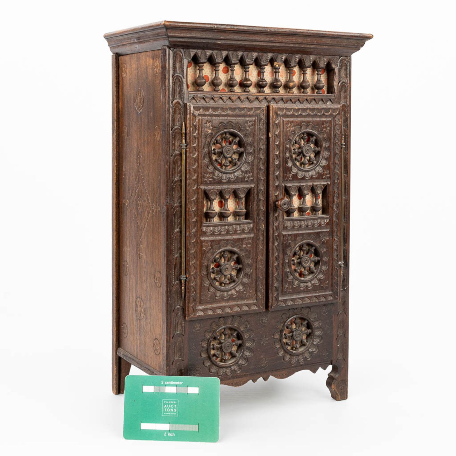 A miniature Breton cabinet, made of sculptured wood. (H:37cm) - Image 2 of 14