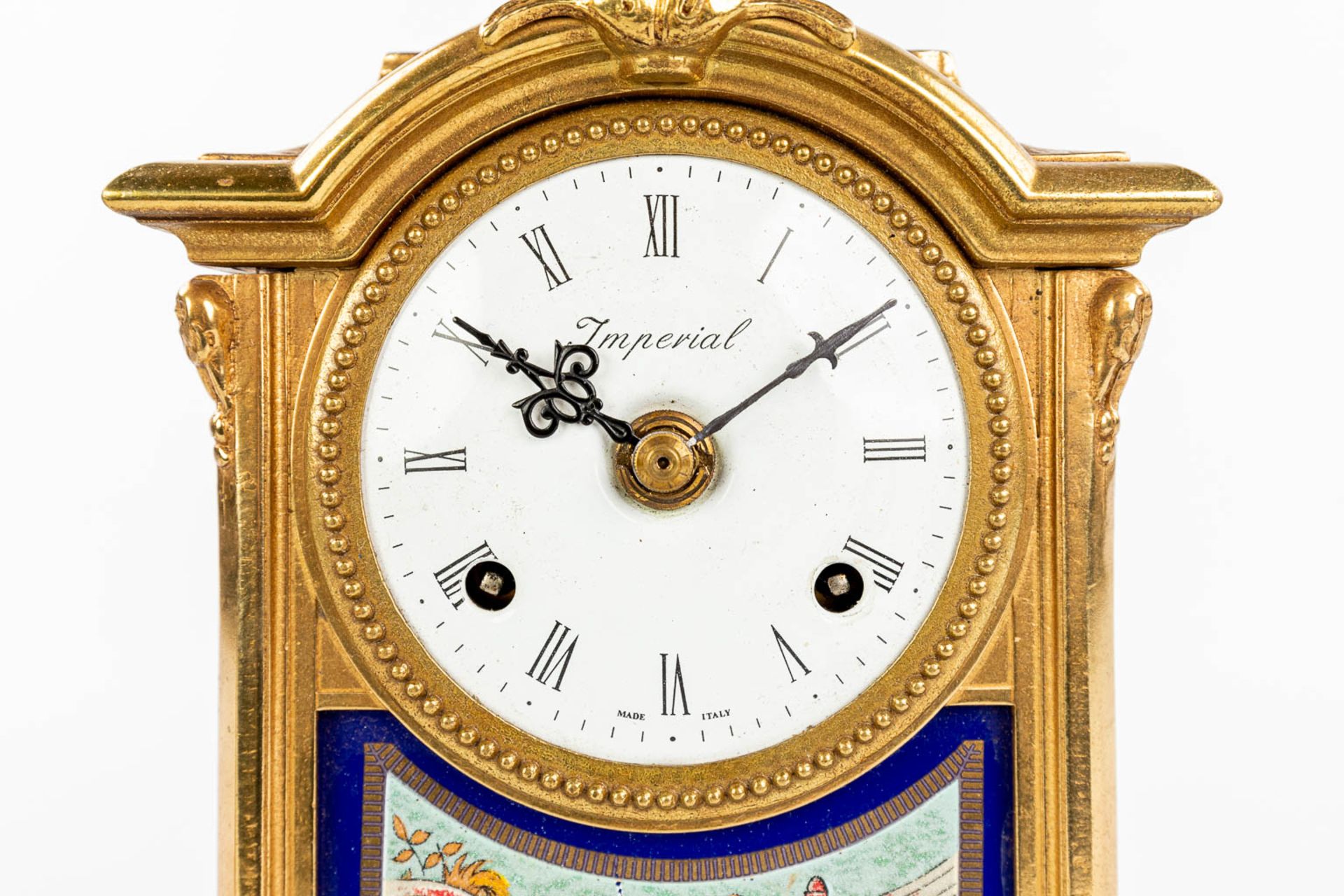 A three-piece mantle garniture clock made of bronze and porcelain and marked Imperial. (H:43cm) - Image 9 of 12