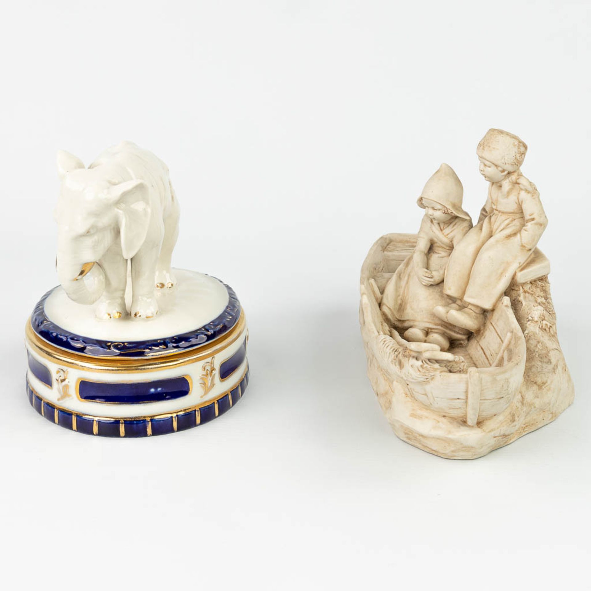 A collection of 2 pieces of Royal Dux porcelain: 'Boys in a boat - Bonbonire with an elephant'. (H: - Image 6 of 13