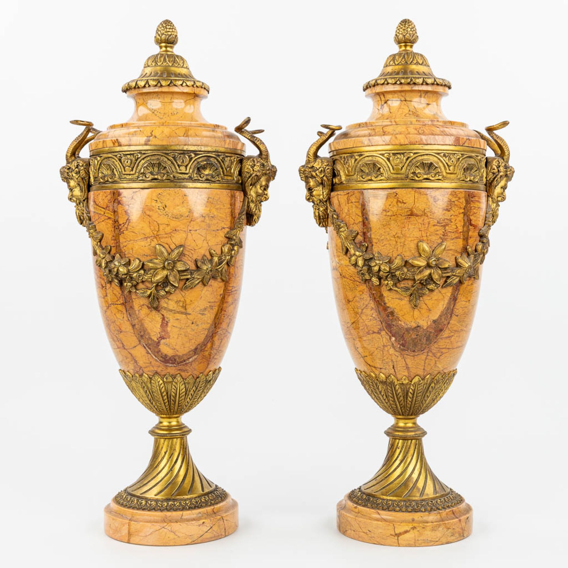 A pair of marble cassolettes mounted with gilt bronze. (H:48,5cm)