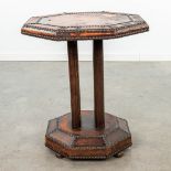 A coffee table made of leather and finished with nails in art deco style. (H:58cm)