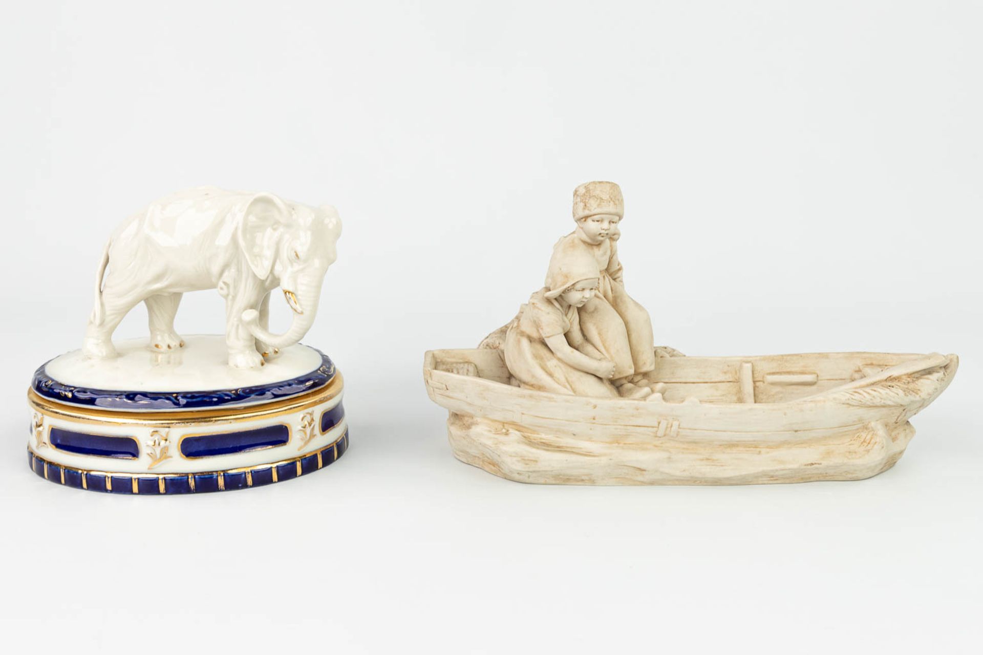 A collection of 2 pieces of Royal Dux porcelain: 'Boys in a boat - Bonbonire with an elephant'. (H: - Image 7 of 13