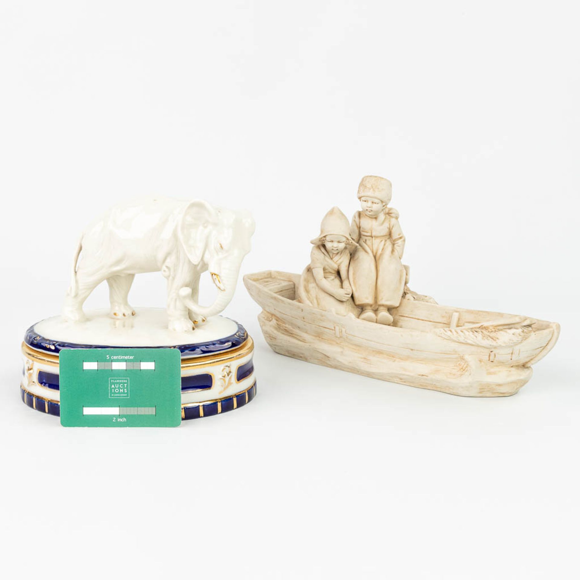 A collection of 2 pieces of Royal Dux porcelain: 'Boys in a boat - Bonbonire with an elephant'. (H: - Image 2 of 13