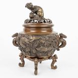An Oriental Brûle Parfum made of patinated bronze and decorated with figurines. (H:28cm)