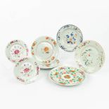 A collection of 7 Chinese Famille Rose plates with hand-painted flower decors.