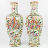 A pair of Chinese Canton vases made of porcelain andÊdecorated with images of 'The Chinese Life' and
