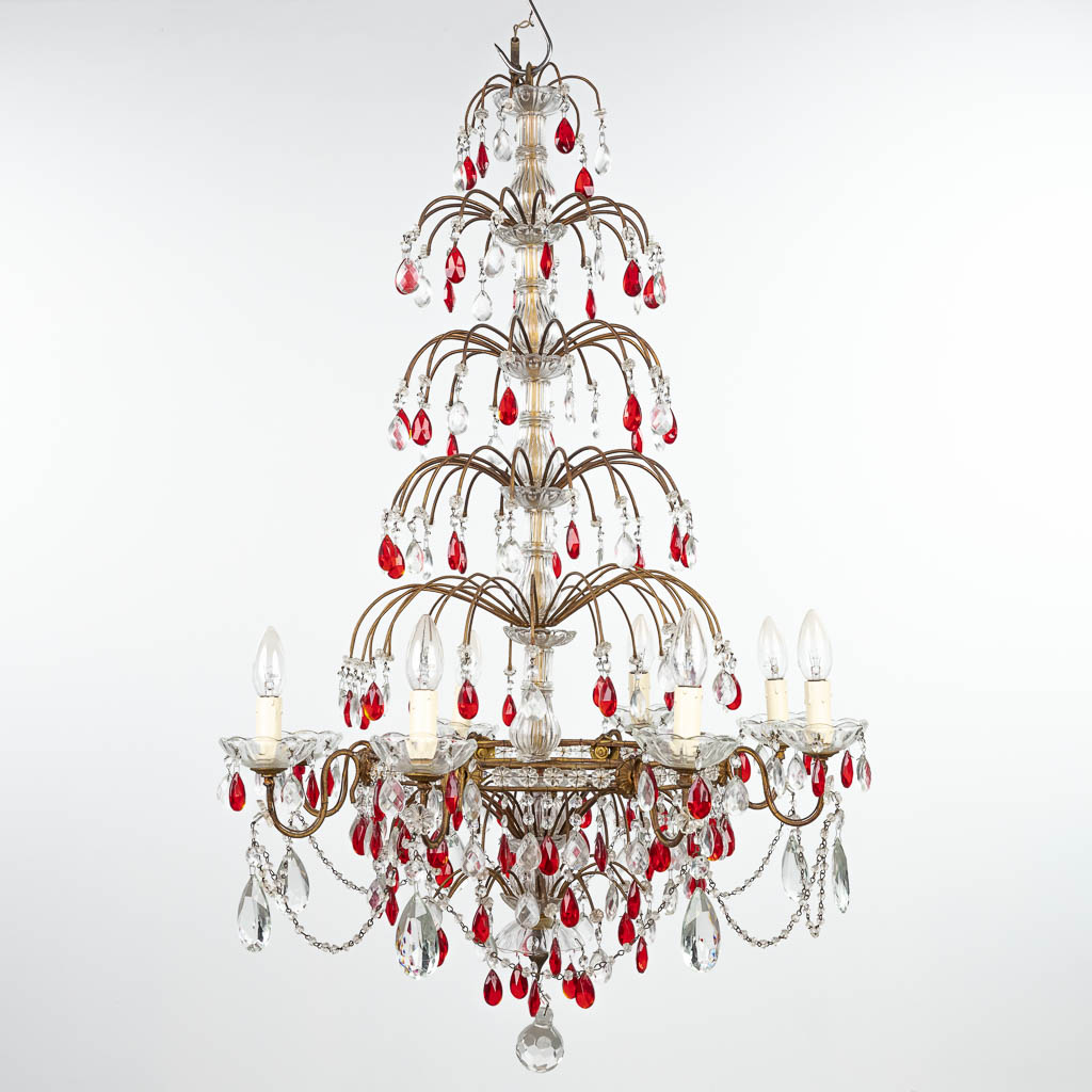 A decorative chandelier made of brass and decorated with white and red glass. (H:95cm)