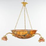 A chandelier made of a large alabaster bowl, mounted with bronze and glass roses.