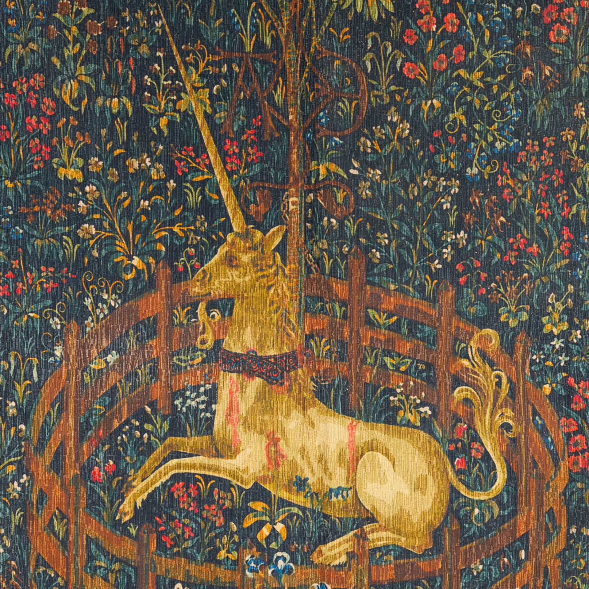 A tapestry with a printed image of a unicorn in a flower field. (H:136cm) - Image 4 of 6