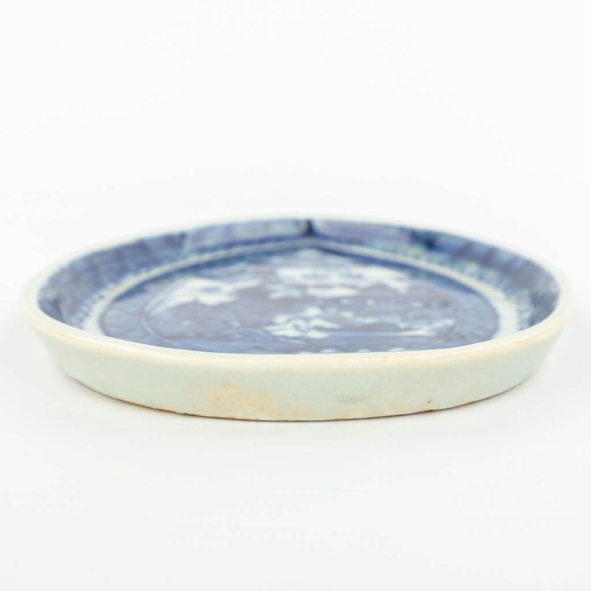 A Chinese dish made of porcelain with a blue-white landscape decor. - Image 7 of 10