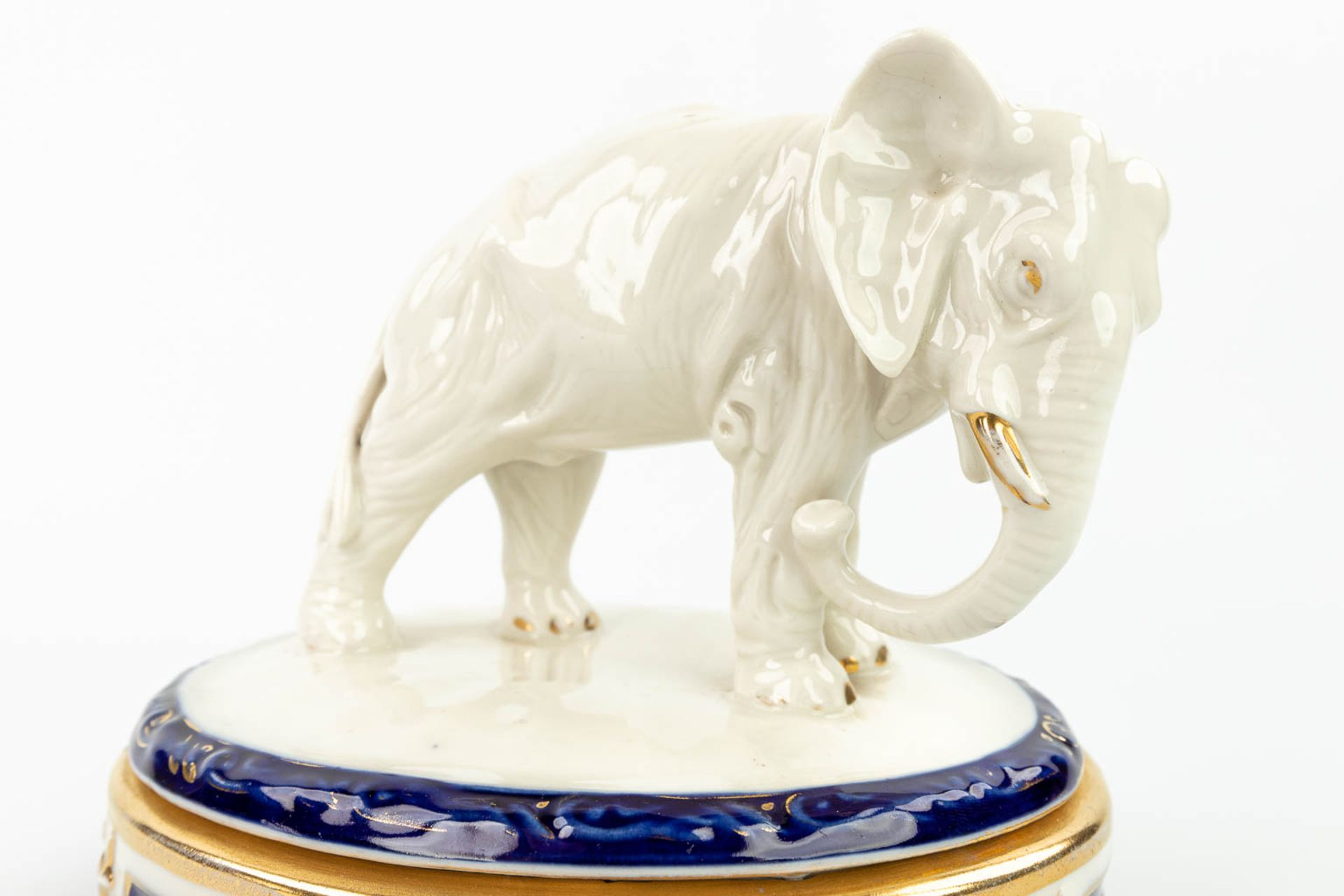A collection of 2 pieces of Royal Dux porcelain: 'Boys in a boat - Bonbonire with an elephant'. (H: - Image 10 of 13