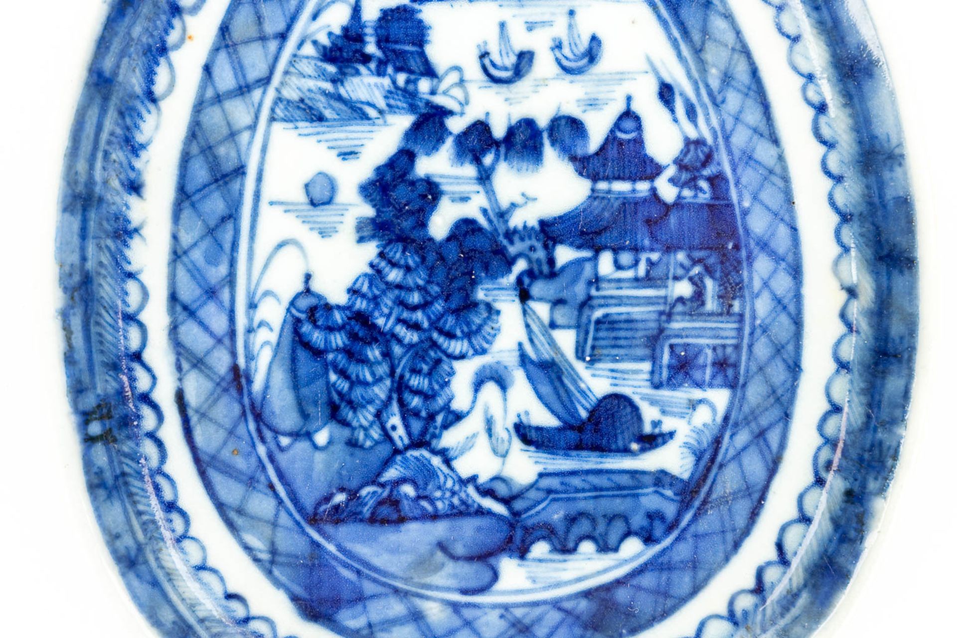 A Chinese dish made of porcelain with a blue-white landscape decor. - Image 5 of 10