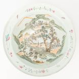 A Chinese bowl made of porcelain and decorated with landscapes. (H:11cm)