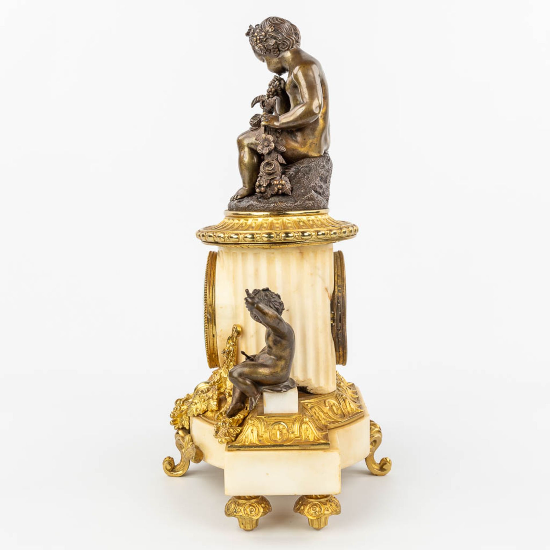 A clock made of marble and decorated with gilt and patinated bronze in Louis XVI style. (H:42cm) - Image 4 of 12