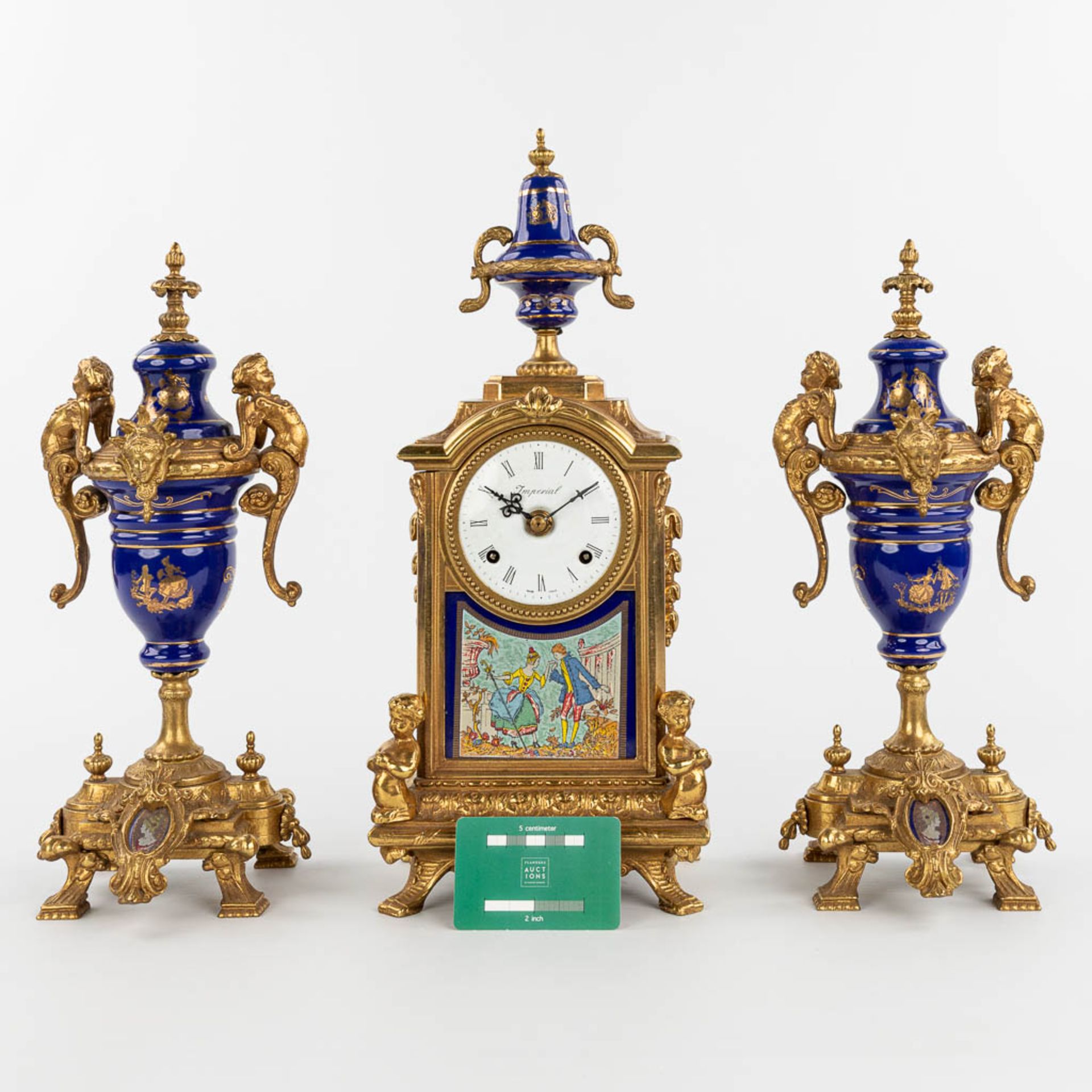 A three-piece mantle garniture clock made of bronze and porcelain and marked Imperial. (H:43cm) - Image 2 of 12