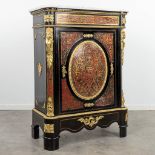 A single door cabinet finished with boulle tortoise shell inlay and mounted with gilt bronze. Napole