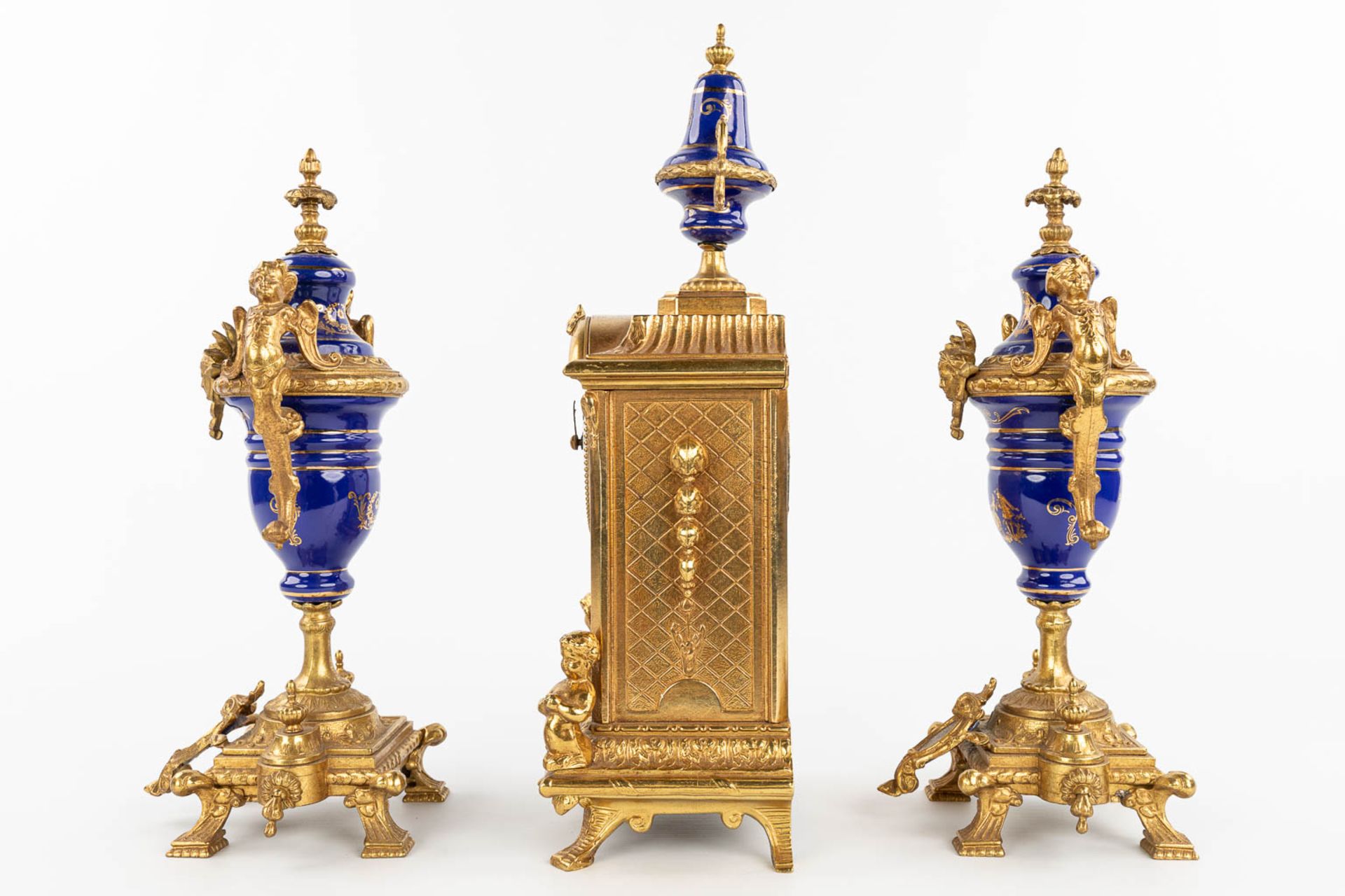 A three-piece mantle garniture clock made of bronze and porcelain and marked Imperial. (H:43cm) - Image 4 of 12