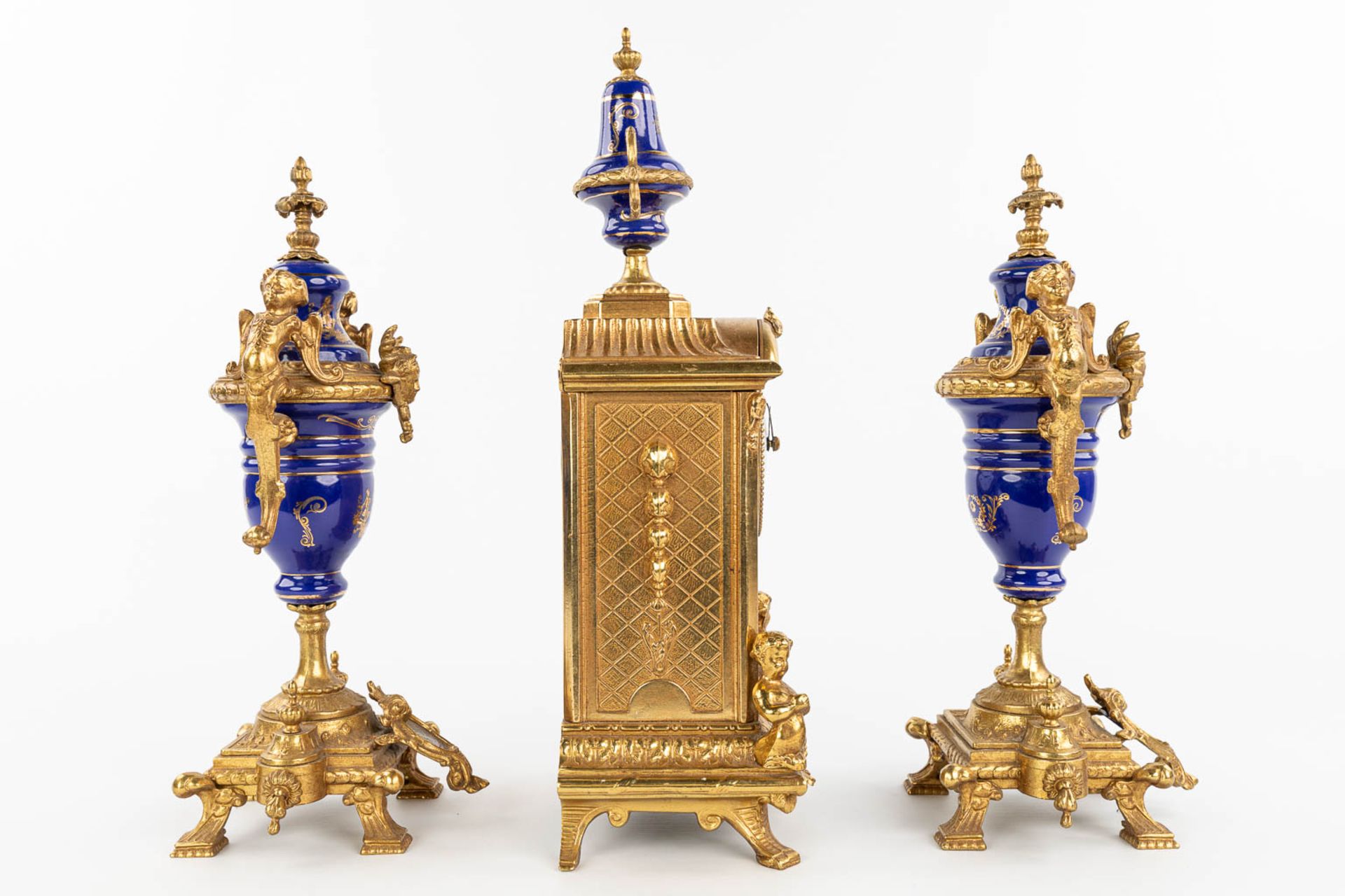 A three-piece mantle garniture clock made of bronze and porcelain and marked Imperial. (H:43cm) - Image 5 of 12