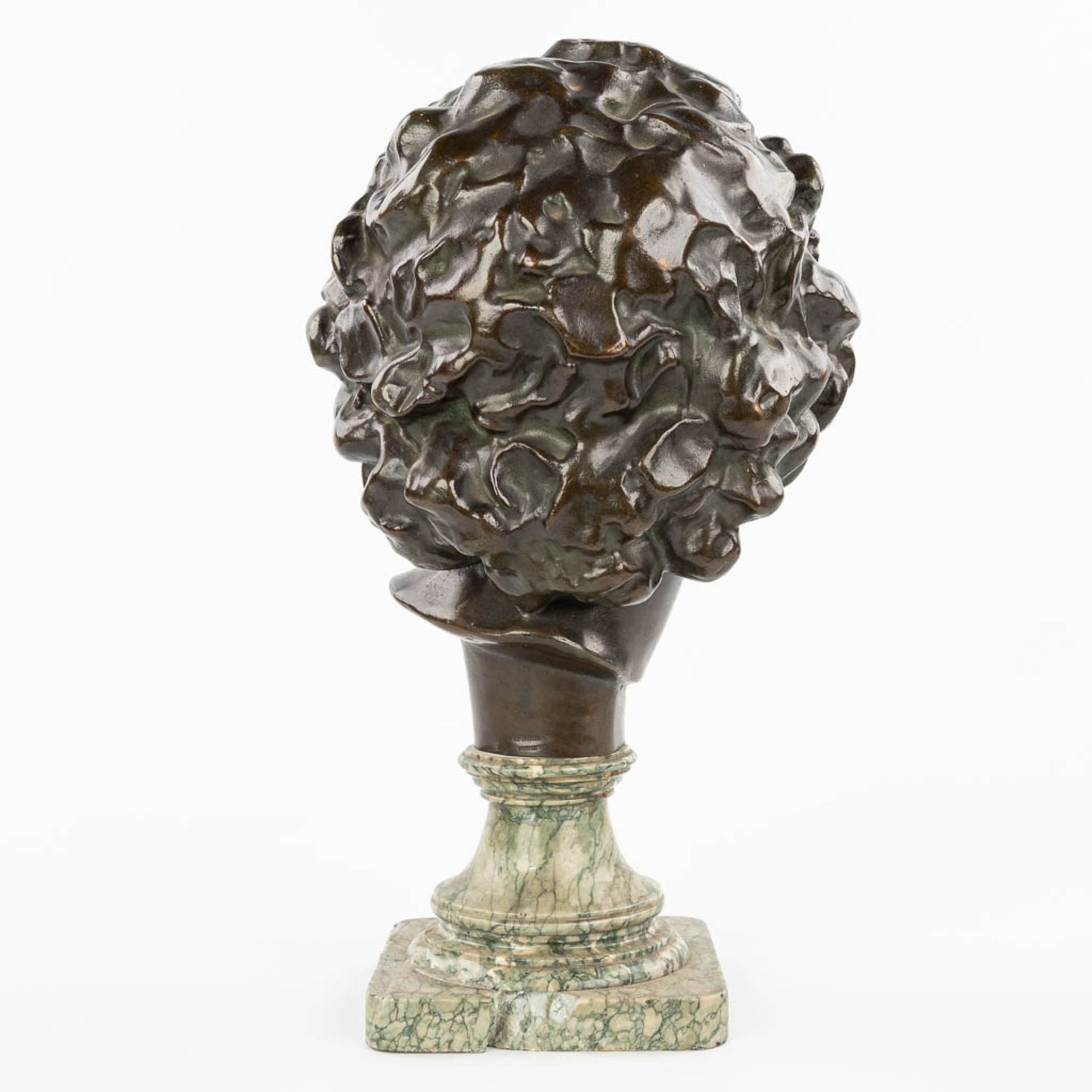 A bronze head of a young man, mounted on a marble base. Marked Peterman, Brussels. (H:40cm) - Image 6 of 11