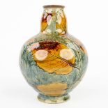 A vase decorated with leaves and made of stoneware marked Royal Doulton. (H:18cm)