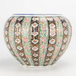 A large Japanese cache-pot, with hand-painted floral decor. (H:30cm)