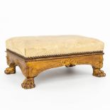 An antique footstool, made of giltwood and standing on claw feet. (H:19cm)