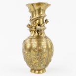 A Chinese bronze vase decorated with a dragon. (11 x 13 x 25 cm)