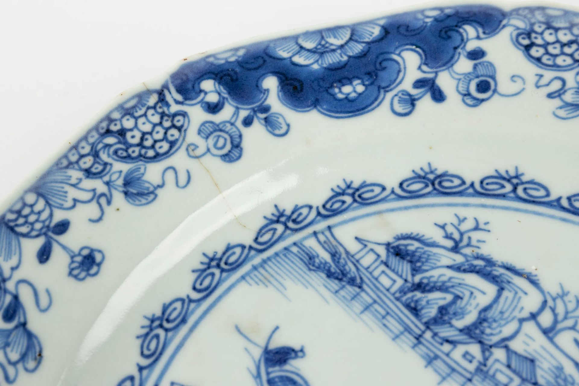 A collection of 7 Chinese plates and platters made of blue-white porcelain. (34 x 40,5 cm) - Image 12 of 23