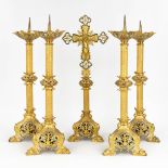 A set of 4 candlesticks and a crucifix, made of brass in gothic revival style. (64cm)