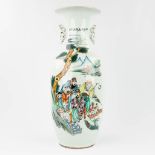 A Chinese vase made of porcelain and decorated with wise men in the garden. (59 x 23 cm)