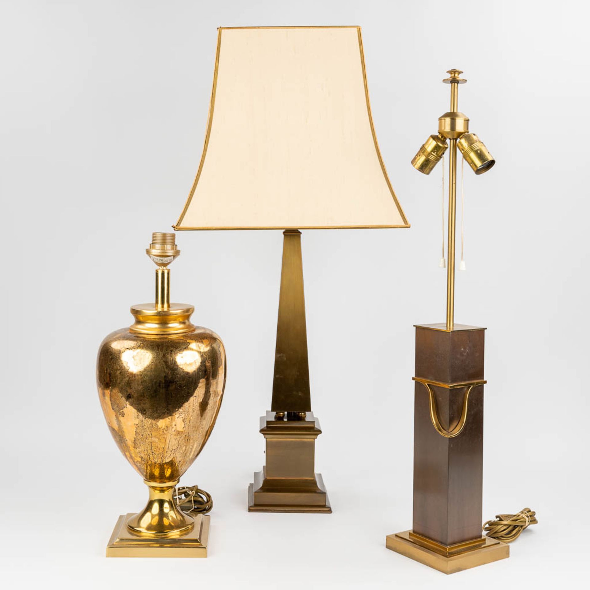 A collection of 3 mid-C. brass and metal table lamps. (14 x 14 x 80cm)